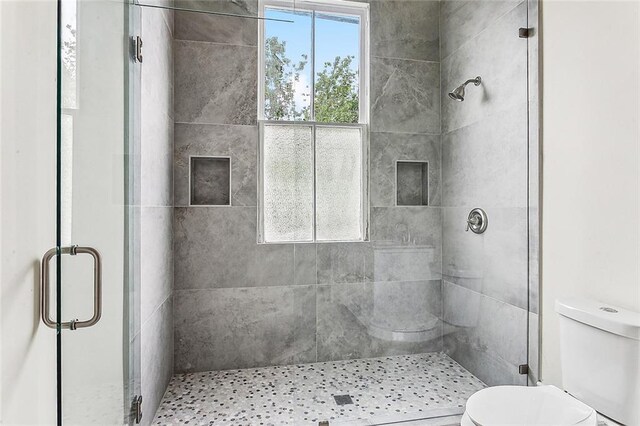 4628 Cleveland Ave, New Orleans, LA 70119 - bathroom featuring toilet and a shower stall