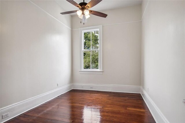 4628 Cleveland Ave, New Orleans, LA 70119 - empty room with dark wood-type flooring, ceiling fan, and baseboards