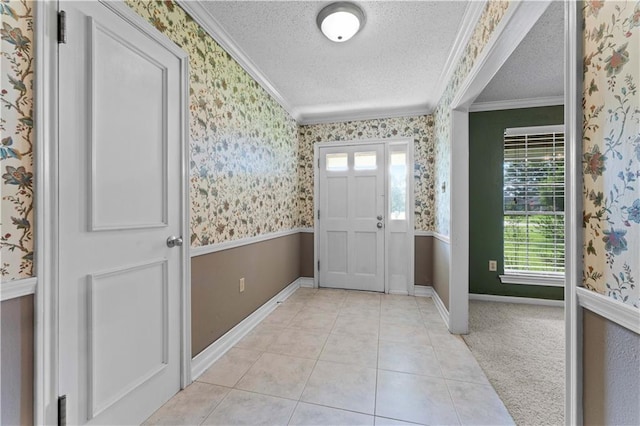 6242 Antioch Blvd, Baton Rouge, LA 70817 - foyer entrance featuring crown molding, healthy amount of natural light, a textured ceiling, wallpapered walls, and light tile patterned floors