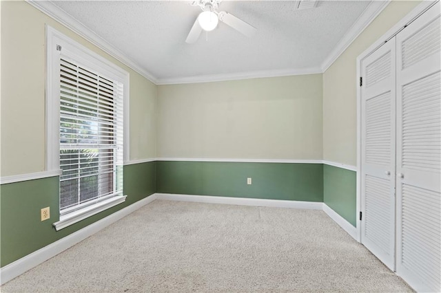 6242 Antioch Blvd, Baton Rouge, LA 70817 - unfurnished bedroom with crown molding, a closet, carpet flooring, baseboards, and a textured ceiling