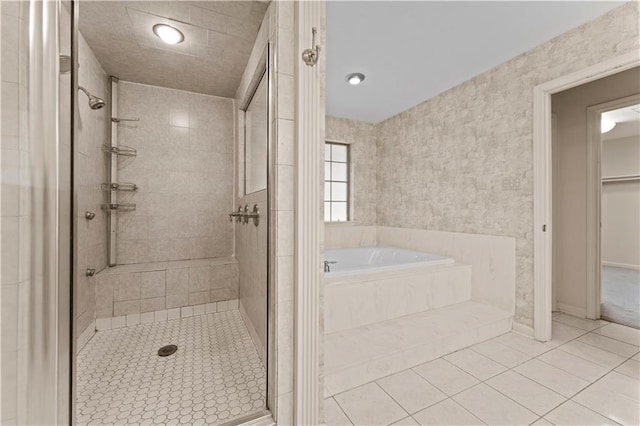 6242 Antioch Blvd, Baton Rouge, LA 70817 - bathroom featuring a stall shower, a bath, tile patterned floors, recessed lighting, and a walk in closet