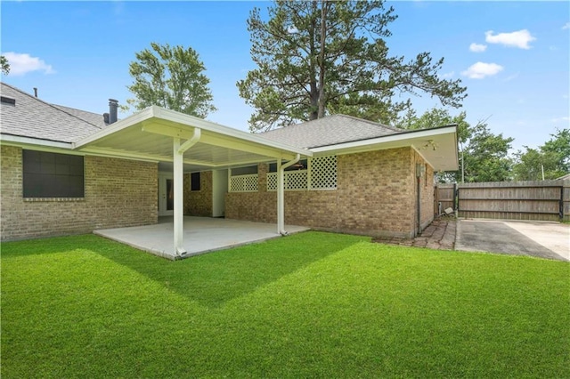 6242 Antioch Blvd, Baton Rouge, LA 70817 - back of house with a patio area, brick siding, and a shingled roof