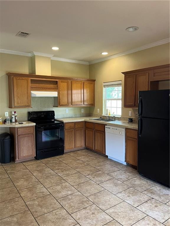 42984 River Birch Ln, Franklinton, LA 70438 - kitchen featuring black appliances, extractor fan, light countertops, brown cabinets, and crown molding