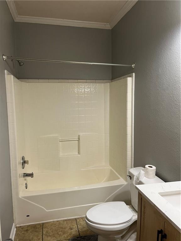 42984 River Birch Ln, Franklinton, LA 70438 - bathroom with crown molding, toilet, vanity, and bathing tub / shower combination