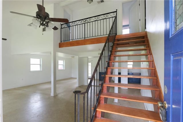 503 Park Blvd, Braithwaite, LA 70040 - staircase featuring a high ceiling, ceiling fan, and concrete floors
