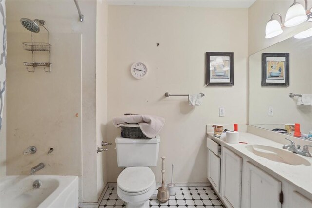 4740 Banks St, New Orleans, LA 70119 - bathroom featuring vanity, toilet, tile patterned floors,  shower combination, and baseboards