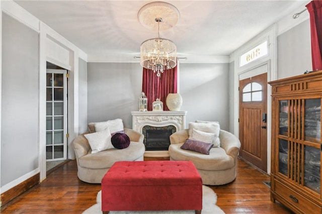 309 Diana St, New Orleans, LA 70114 - living area featuring wood-type flooring, a chandelier, and baseboards