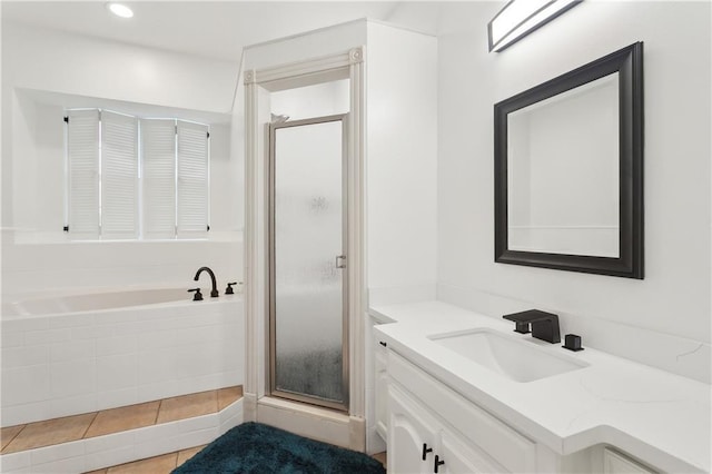 733 Plantation Dr, Abita Springs, LA 70420 - bathroom featuring vanity, a stall shower, a bath, and tile patterned flooring