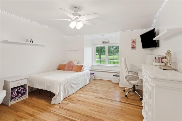 733 Plantation Dr, Abita Springs, LA 70420 - bedroom with light wood-type flooring and ceiling fan