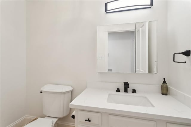 733 Plantation Dr, Abita Springs, LA 70420 - bathroom featuring toilet and vanity