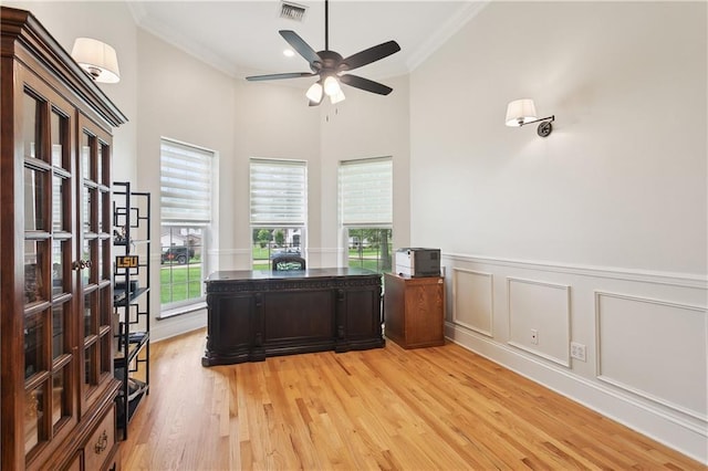 733 Plantation Dr, Abita Springs, LA 70420 - office with ornamental molding, a ceiling fan, light wood-style flooring, plenty of natural light, and wainscoting