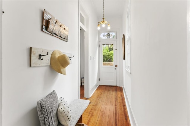 2728 Bell St, New Orleans, LA 70119 - doorway featuring light wood-style flooring and baseboards
