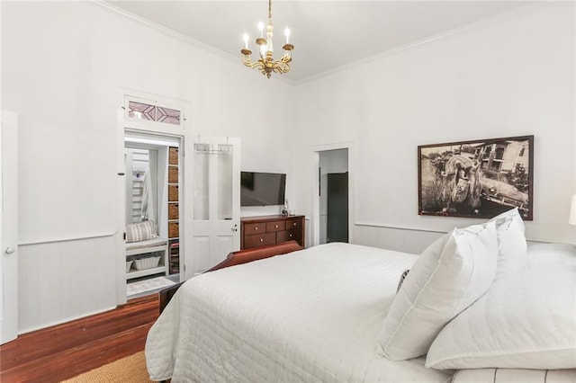 2728 Bell St, New Orleans, LA 70119 - bedroom featuring wood finished floors, a chandelier, and crown molding
