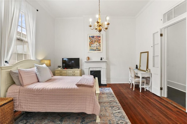 2728 Bell St, New Orleans, LA 70119 - bedroom featuring a chandelier, dark wood finished floors, ornamental molding, baseboards, and a fireplace