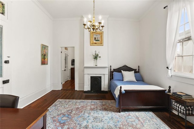 2728 Bell St, New Orleans, LA 70119 - bedroom featuring a chandelier, wood finished floors, crown molding, and baseboards