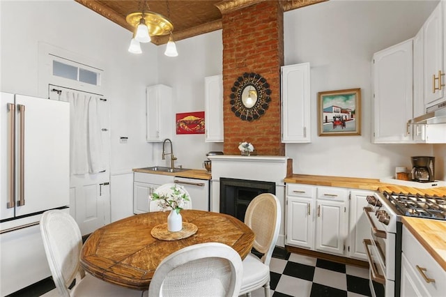 2728 Bell St, New Orleans, LA 70119 - kitchen featuring premium appliances, butcher block counters, and white cabinets