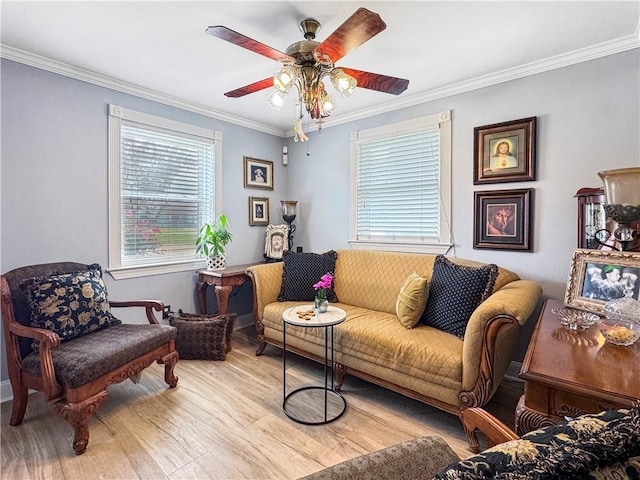 4153 W Loyola Dr, Kenner, LA 70065 - living room with wood finished floors, ornamental molding, healthy amount of natural light, a ceiling fan, and baseboards
