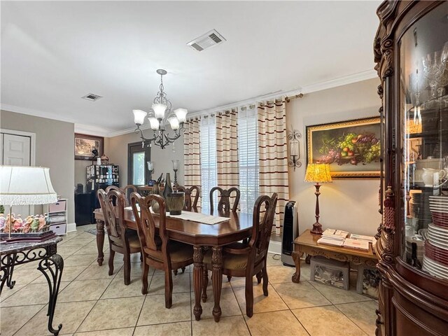 4153 W Loyola Dr, Kenner, LA 70065 - dining room with a chandelier, light tile patterned floors, and ornamental molding