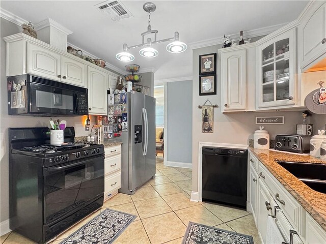 4153 W Loyola Dr, Kenner, LA 70065 - kitchen featuring black appliances, glass insert cabinets, ornamental molding, hanging light fixtures, and white cabinets