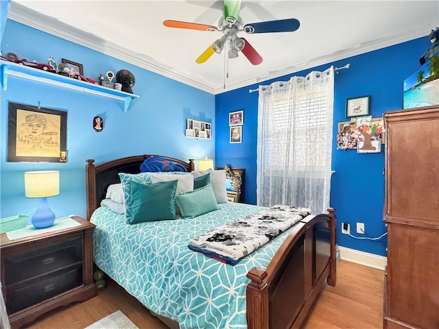 4153 W Loyola Dr, Kenner, LA 70065 - bedroom featuring wood finished floors, ornamental molding, baseboards, and a ceiling fan