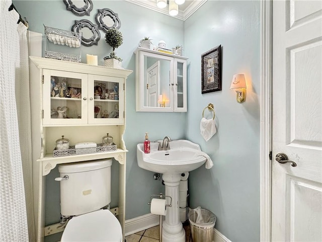 4153 W Loyola Dr, Kenner, LA 70065 - full bath with baseboards, ornamental molding, toilet, tile patterned floors, and a shower with curtain