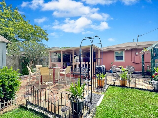 4153 W Loyola Dr, Kenner, LA 70065 - rear view of property with a patio area, ceiling fan, and outdoor dining space
