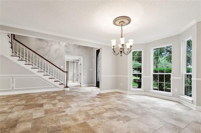 102 Ayshire Ct, Slidell, LA 70461 - empty room featuring stone finish floors, a chandelier, stairway, ornamental molding, and a textured ceiling