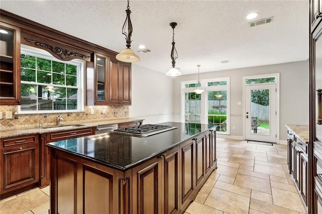 102 Ayshire Ct, Slidell, LA 70461 - kitchen featuring a sink, tasteful backsplash, a center island, stainless steel appliances, and recessed lighting