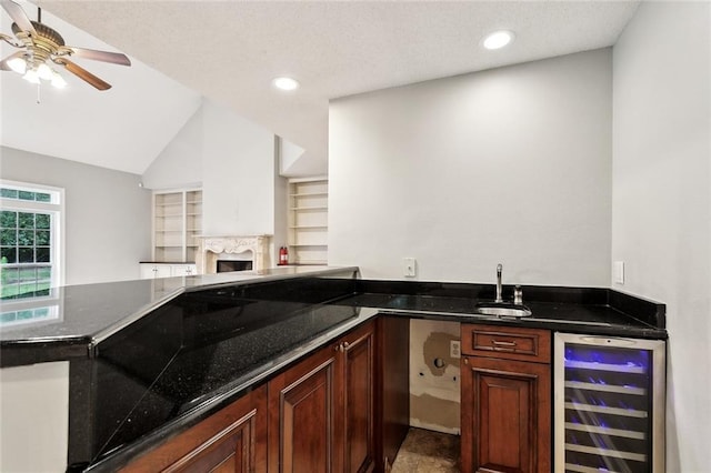 102 Ayshire Ct, Slidell, LA 70461 - indoor wet bar with beverage cooler, ceiling fan, a high end fireplace, vaulted ceiling, and recessed lighting