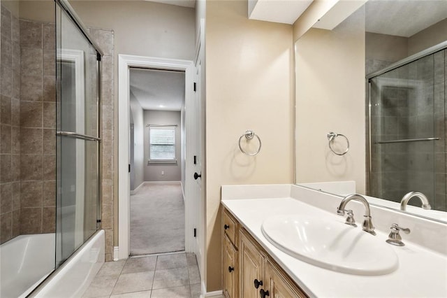 102 Ayshire Ct, Slidell, LA 70461 - full bath with tile patterned floors, vanity, baseboards, and combined bath / shower with glass door