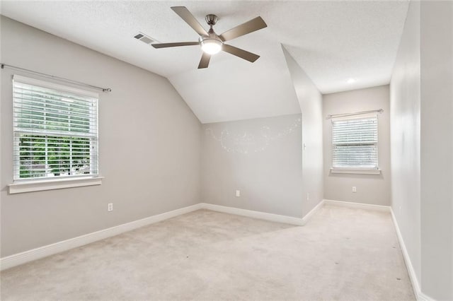 102 Ayshire Ct, Slidell, LA 70461 - additional living space with carpet, ceiling fan, baseboards, and lofted ceiling