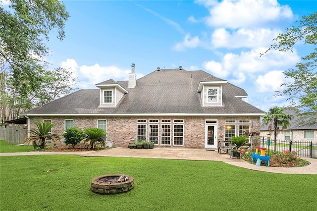 102 Ayshire Ct, Slidell, LA 70461 - back of house featuring a fire pit, a patio, brick siding, and a chimney