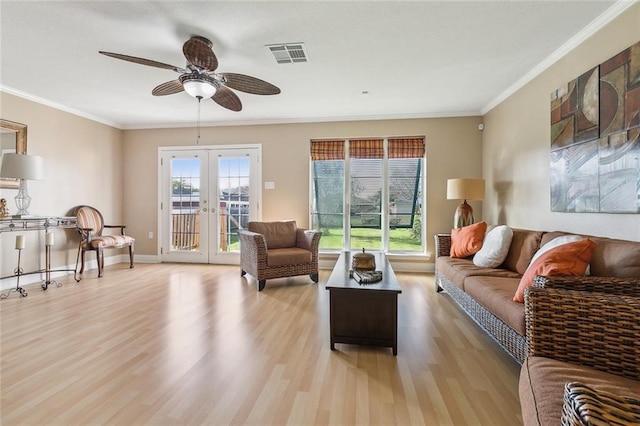 4608 Loveland St, Metairie, LA 70006 - living room featuring french doors, a ceiling fan, wood finished floors, ornamental molding, and baseboards