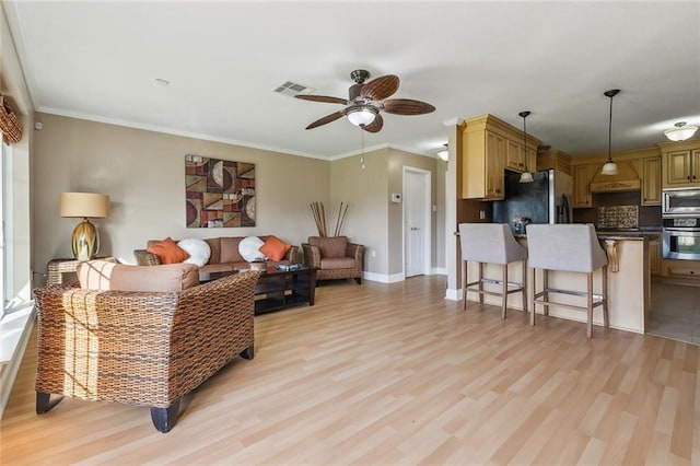 4608 Loveland St, Metairie, LA 70006 - living room featuring ceiling fan, light wood-type flooring, crown molding, and baseboards