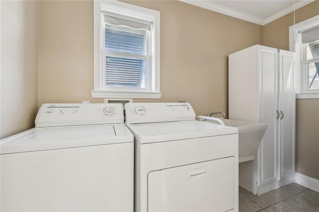 4608 Loveland St, Metairie, LA 70006 - laundry room with separate washer and dryer, crown molding, light tile patterned flooring, and baseboards