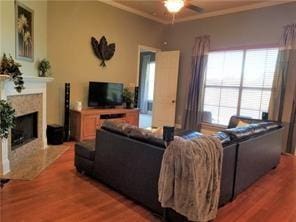270 Nicklaus Dr, Slidell, LA 70458 - living room with ceiling fan, light wood-style flooring, crown molding, and a fireplace