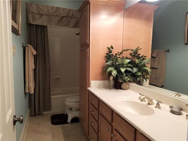 270 Nicklaus Dr, Slidell, LA 70458 - full bath with vanity, toilet, tile patterned flooring, and shower / bath combination with curtain