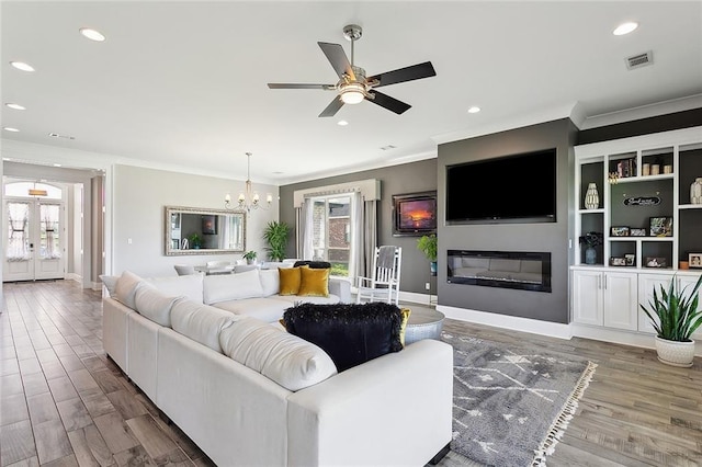 317 E Augusta Ln, Slidell, LA 70458 - living room featuring plenty of natural light, ornamental molding, recessed lighting, wood finished floors, and ceiling fan