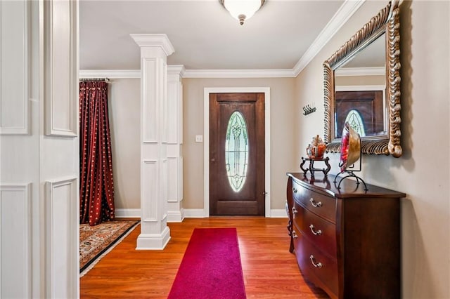 3845 Croydon St, Slidell, LA 70458 - entryway featuring light wood finished floors, ornate columns, baseboards, and ornamental molding