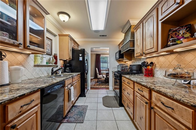 3845 Croydon St, Slidell, LA 70458 - kitchen featuring black appliances, a sink, dark stone counters, light tile patterned floors, and crown molding