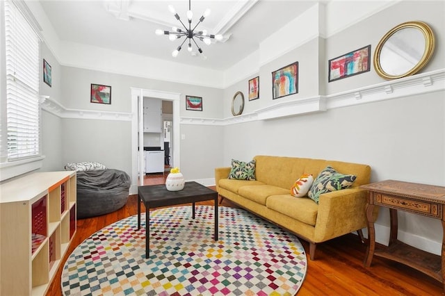 2933 Calhoun St Unit 2933, New Orleans, LA 70118 - living room featuring wood finished floors, a chandelier, and baseboards