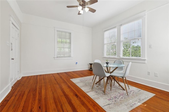 2933 Calhoun St Unit 2933, New Orleans, LA 70118 - dining area with ceiling fan, wood finished floors, and baseboards