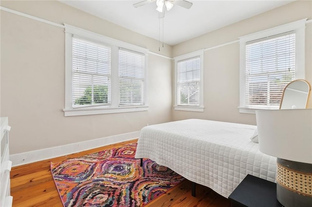 2933 Calhoun St Unit 2933, New Orleans, LA 70118 - bedroom featuring hardwood / wood-style floors, baseboards, and a ceiling fan