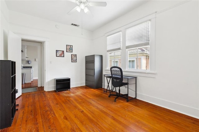 2933 Calhoun St Unit 2933, New Orleans, LA 70118 - office space with ceiling fan, wood finished floors, and baseboards