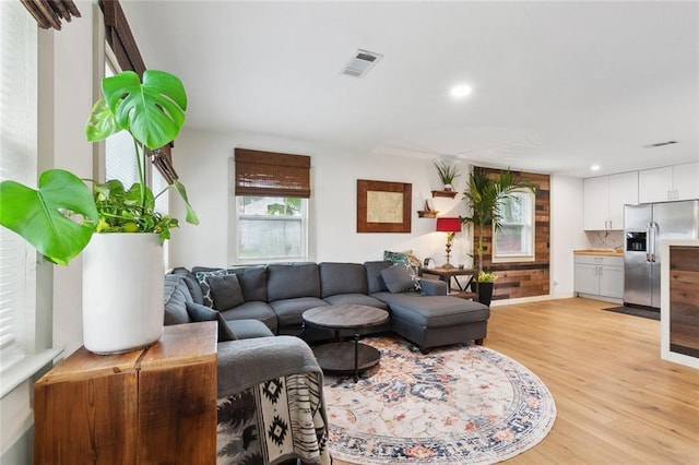2405 Mariette Dr, Chalmette, LA 70043 - living area with light wood finished floors, recessed lighting, and baseboards