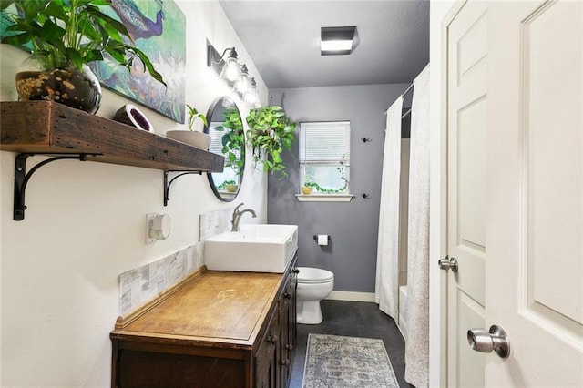 2405 Mariette Dr, Chalmette, LA 70043 - full bath featuring vanity, toilet, concrete flooring, and baseboards