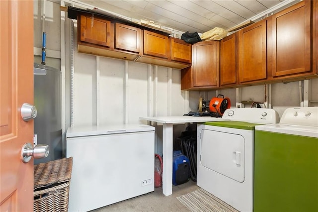 2405 Mariette Dr, Chalmette, LA 70043 - laundry room featuring washer and clothes dryer, cabinet space, and water heater