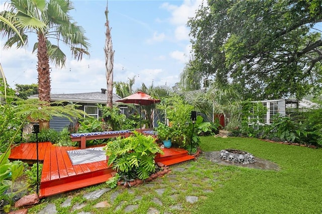 2405 Mariette Dr, Chalmette, LA 70043 - view of grassy yard with a wooden deck