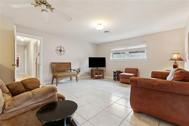 4508 Hastings St, Metairie, LA 70006 - living room featuring light tile patterned floors, attic access, ceiling fan, and baseboards