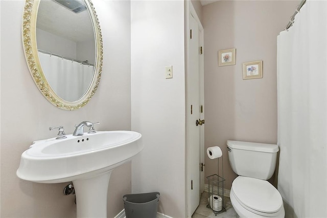 4508 Hastings St, Metairie, LA 70006 - full bathroom featuring toilet, a sink, and tile patterned flooring